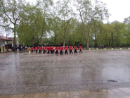 Band of the Coldstream Guards return leaving the Guards to march in silent mode through the rain